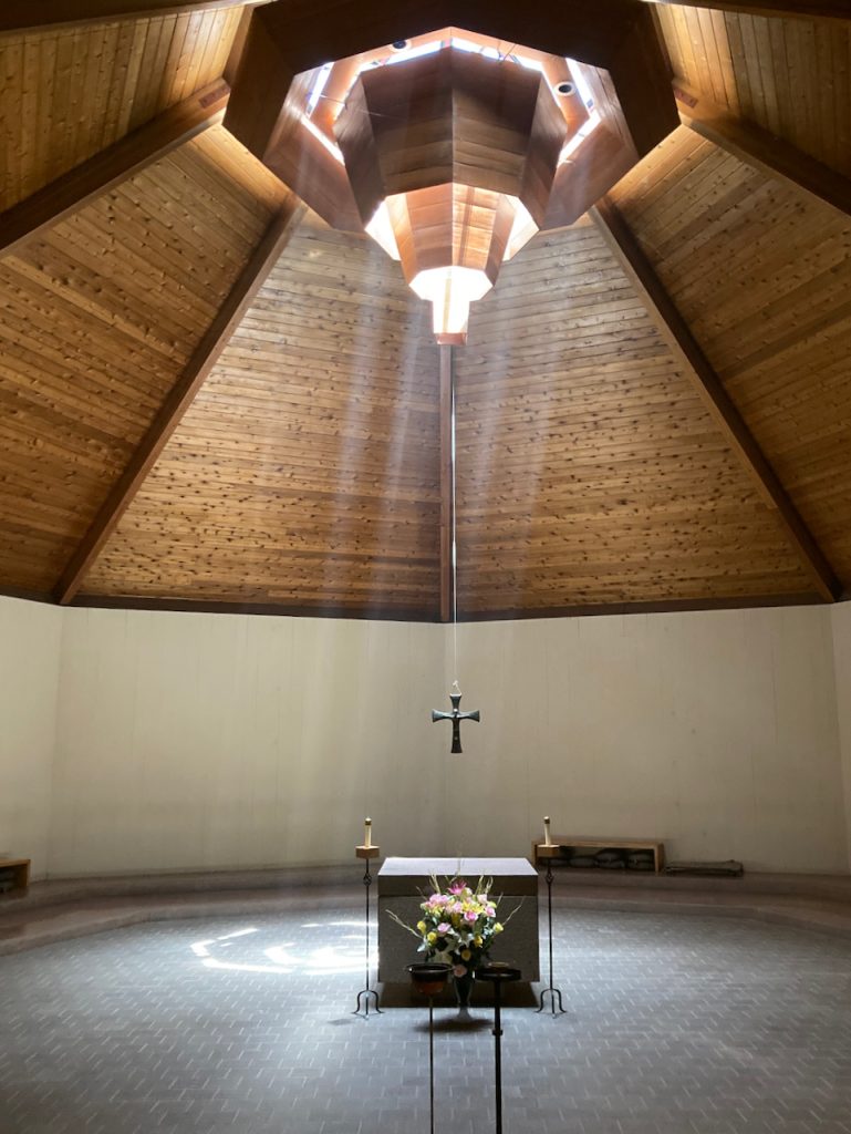 A shaft of light falling across the chapel at New Camaldoli Hermitage